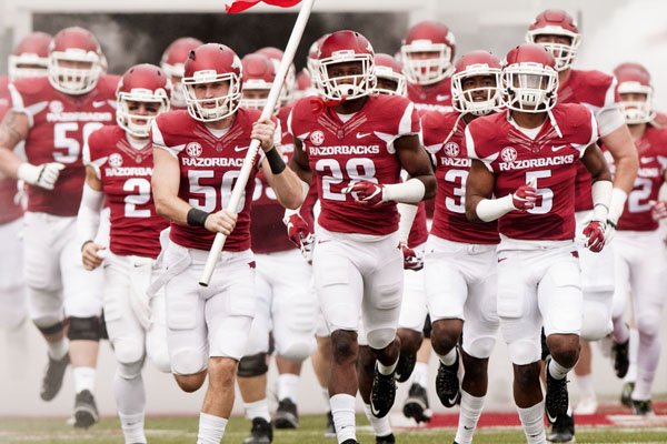 Arkansas players run onto the field before the Razorbacks' game against UT Martin on Saturday, Oct. 31, 2015, at Razorback Stadium.