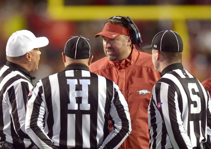 NWA Democrat-Gazette/BEN GOFF @NWABENGOFF
Bret Bielema, Arkansas coach, consults with officials in the second quarter against Mississippi State on Saturday Nov. 21, 2015 during the game in Razorback Stadium in Fayetteville.