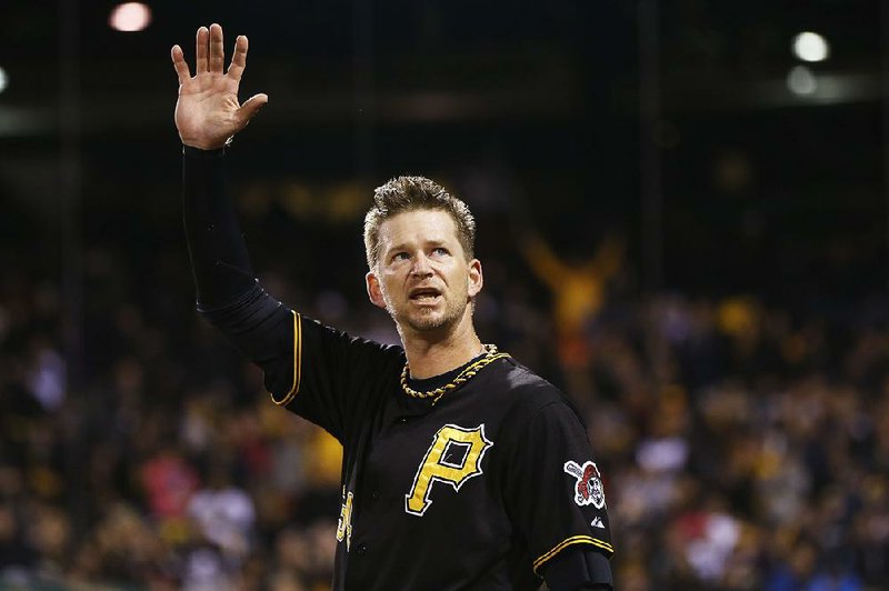 Pittsburgh Pirates starting pitcher A.J. Burnett (34) waves to the fans after being lifted in the seventh inning of a baseball game against the Cincinnati Reds, Saturday, Oct. 3, 2015, in Pittsburgh. This was Burnett's last start in regular season as he had announced earlier in the year he was retiring at the end of this season. 
