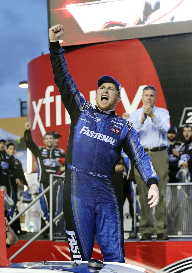 Chris Buescher celebrates after winning the season title, following the NASCAR Xfinity Series auto race, Saturday, Nov. 21, 2015, at Homestead-Miami Speedway in Homestead, Fla. 