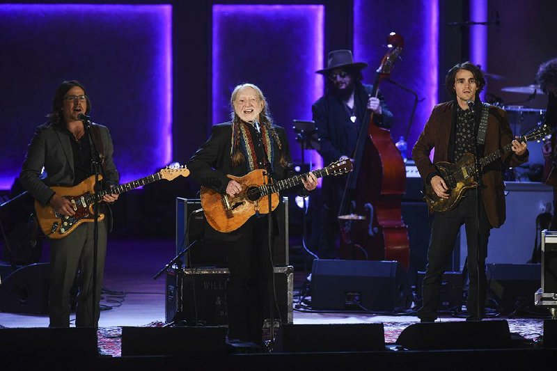 Willie Nelson (center) performs Wednesday with his sons Lukas (left) and Jacob Micah (right) after receiving the Gershwin Prize for Popular Song at the Library of Congress.