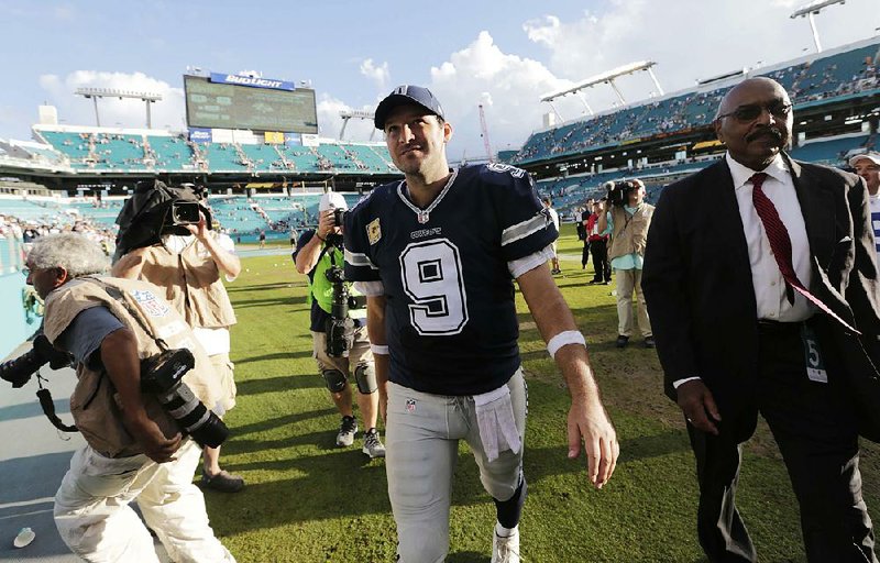 Dallas quarterback Tony Romo returned after missing the previous seven games and completed 18 of 28 passes for 227 yards and 2 touchdowns as Dallas won for the fi rst time since Sept. 20 by beating Miami 24-14 on Sunday.