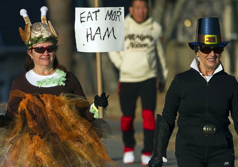 A festive turkey and a Pilgrim participated in the 2014 Go!bbler Turkey Trot in Little Rock.