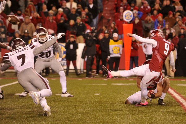 Arkansas kicker Cole Hedlund has his field goal attempt blocked by Mississippi State defenders in the final seconds of the fourth quarter Saturday, Nov. 21, 2015, at Razorback Stadium.