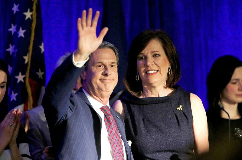 Sen. David Vitter, R-La., and his wife, Wendy, react to the crowd during his election night watch party in Kenner, La., on Saturday. Vitter’s loss in Louisiana’s governor’s race over the weekend and his decision to leave the Senate next year creates an open seat that Republicans will have to defend.