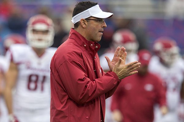 Arkansas offensive coordinator Dan Enos watches warmups prior to a game against Ole Miss on Saturday, Nov. 7, 2015, at Vaught-Hemingway Stadium in Oxford, Miss. 