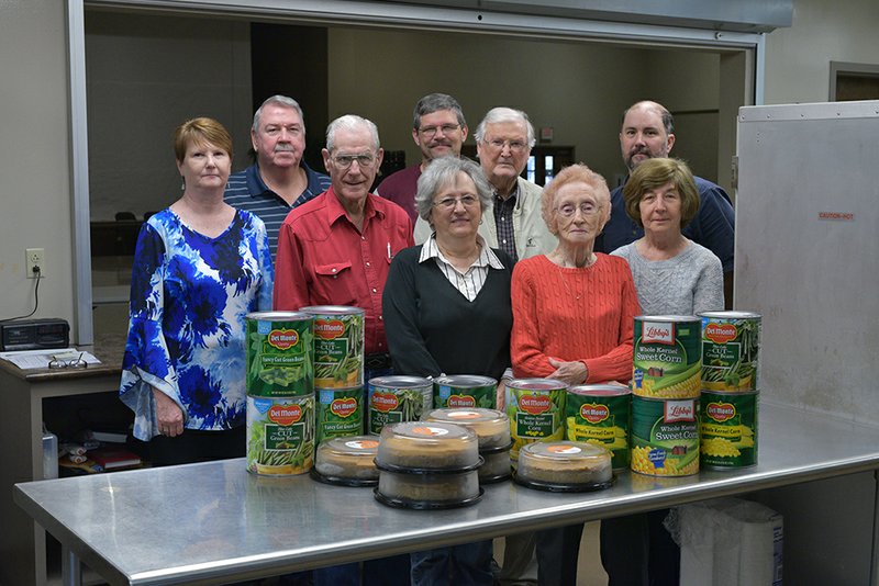 Among those getting ready for the annual community Thanksgiving meal at West Race Baptist Church in Searcy are, front row, from left, Linda Stevens and Billie Lassiter; middle row, Cindy Sullivan, Verlon Stevens, Bill Lassiter and Paulette Stout; and back row, Dean Stout, Don Hill and Randy Allred. The church will serve the free meal from 11 a.m. to 1 p.m. today.