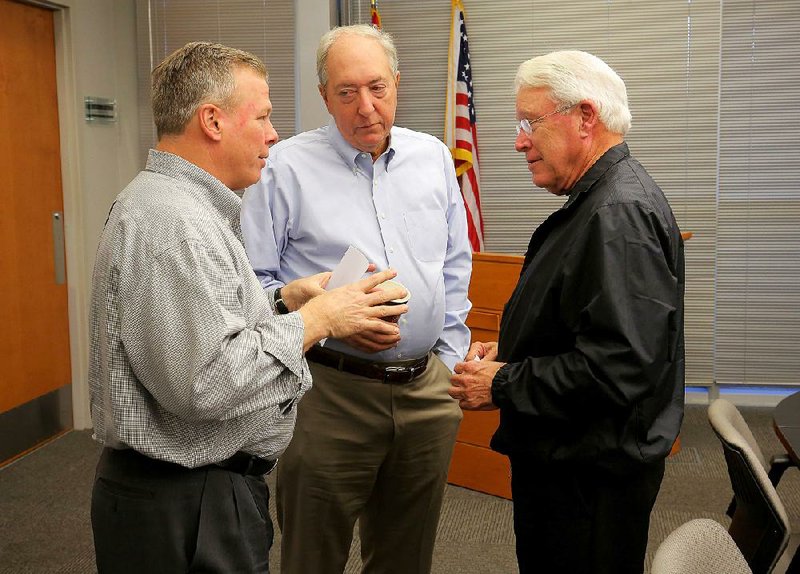Little Rock Technology Park board members Jay Chesshir (from left), Kevin Zaffaroni and Tom Butler talk Tuesday after a board meeting. 