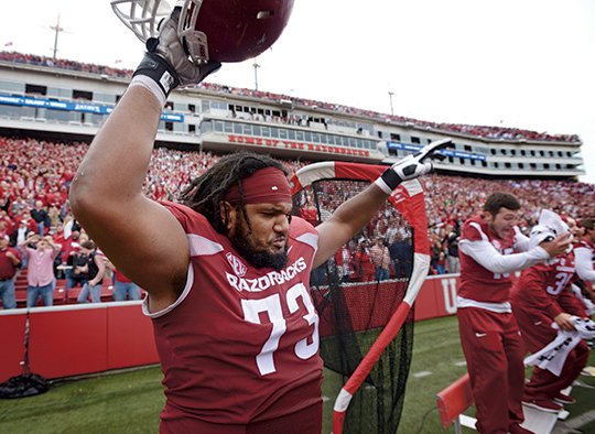 NWA Democrat-Gazette/Ben Goff ALL-STAR TREATMENT: Arkansas left guard Sebastian Tretola, here celebrating the Razorbacks' Oct. 24 victory over Auburn, and running back Jonathan Williams have accepted Senior Bowl invitations, it was announced Tuesday in Mobile, Ala., site of the Jan. 30 all-star game.