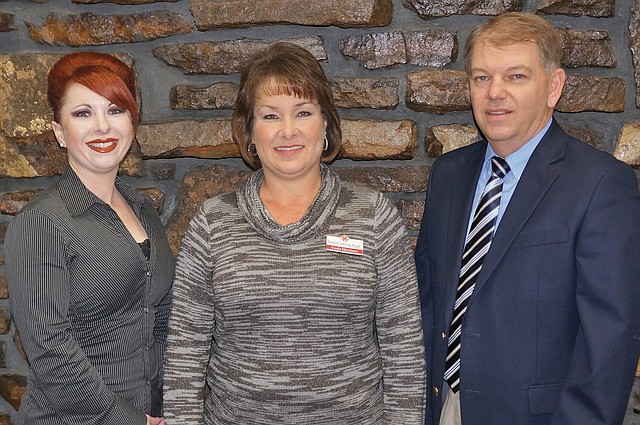 Submitted Photo Pictured at Grand Savings Bank are: Lisa Munoz, consumer loan officer; Carla Martinez, Gentry and Decatur market president; and Kevin Rieff, vice president.