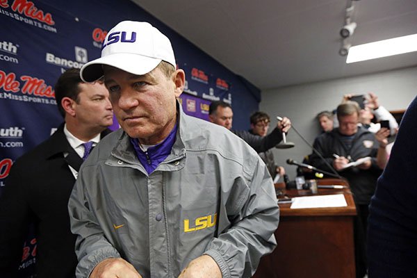 LSU head coach Les Miles leaves a media availability with reporters following an NCAA college football game against Mississippi in Oxford, Miss., Saturday, Nov. 21, 2015. No. 25 Mississippi won 38-17. (AP Photo/Rogelio V. Solis)