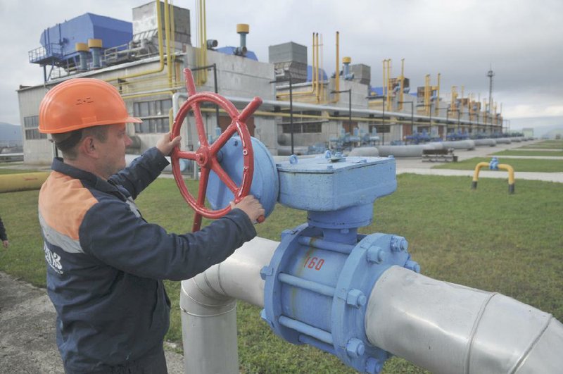 A worker attends to a valve at a Ukrainian gas plant in October. Russia’s Gazprom said Wednesday that it halted natural-gas sales to Ukraine, while Ukraine said it made the decision to stop buying the fuel.