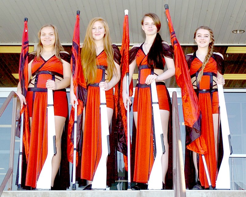 Photo by Rick Peck Four members of the McDonald County High School band color guard will travel to Iowa on Nov. 27 for auditions for Drum Corps International. This is the first time in the history of the school that anyone has tried out for the squad. From left are, Maria Shoemaker, Alaina Brown, Cailet Bowman and Zoey Meador.