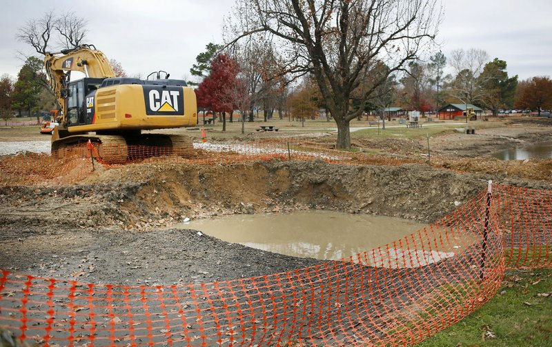  A part of Murphy Park in Springdale is cordoned off Wednesday as work begins there and continues near Shiloh Square on Emma Avenue by the Springdale Water Utilities.