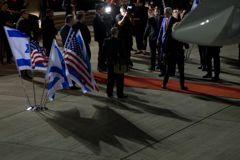 U.S. Secretary of State John Kerry, right, says goodbye on departure from Israel after meetings in Jerusalem and the West Bank city of Ramallah, Tuesday, Nov. 24, 2015, en route back to the United States. 