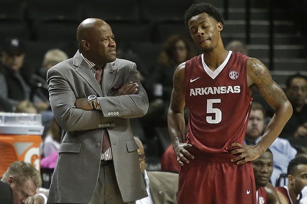 Arkansas head coach Mike Anderson, left, talks to Anthlon Bell (5) during the second half of an NCAA college basketball game against Georgia Tech Thursday, Nov. 26, 2015, in New York. (AP Photo/Frank Franklin II)
