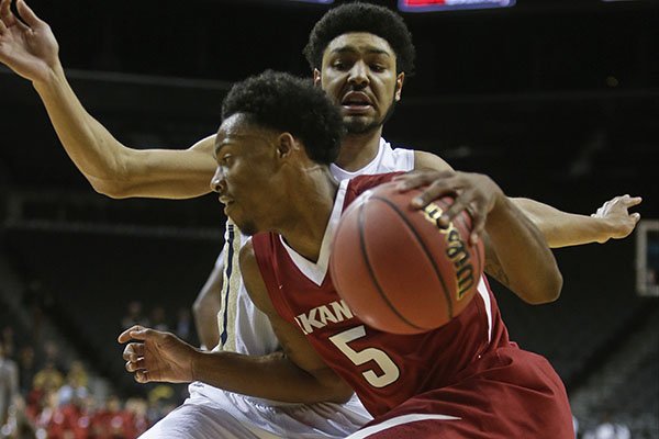 Arkansas's Anthlon Bell (5) drives past Georgia Tech's Josh Heath (11) during the first half of an NCAA college basketball game Thursday, Nov. 26, 2015, in New York. (AP Photo/Frank Franklin II)