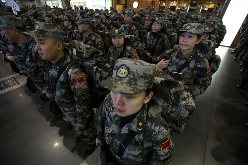 A Chinese medical contingent of more than 200 personnel, mostly from a military medical academy and several army hospitals, prepare to deploy Nov. 14, 2014, to West Africa to help in the fight against Ebola from the airport in Beijing.