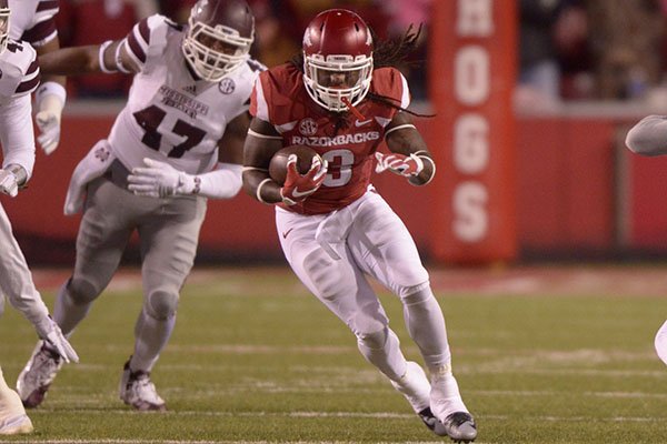 Arkansas running back Alex Collins carries the ball during a game against Mississippi State on Saturday, Nov. 21, 2015, at Razorback Stadium in Fayetteville. 