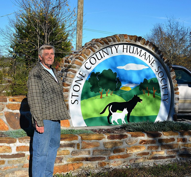 Jerry Weber, Stone County Humane Society board member, poses next to the facility’s new sign. 