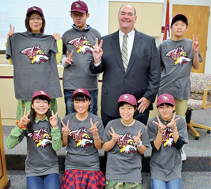 Submitted photo The Lake Hamilton School District and Superintendent Steve Anderson, back, second from right, welcomed six Japanese students, a teacher and a translator Nov. 4 for a visit through the Visit Hot Springs Sister City Program. The group from Hanamaki, Japan, was welcomed by administrators and central office staff at the administration building. They gave a presentation to the staff and were crowned "honorary Lake Hamilton Wolves" by Anderson. Each received a Lake Hamilton shirt and cap. The students spent the remainder of the day visiting classrooms throughout the district.