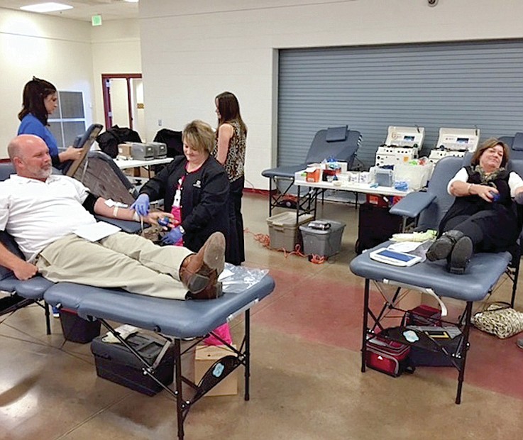 Submitted photo Lake Hamilton Intermediate School Principal Stacy Howell, left, and teacher Cheri Walker, right, donated blood at the Arkansas Blood Institute drive in the intermediate school cafeteria Nov. 5.