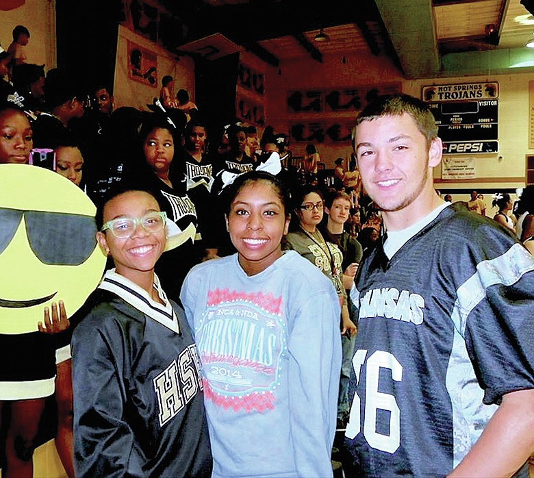 Submitted photo Hot Springs High School students, from left, Amber Peppers, Octavia Shaw and William Brown were among attendees to an early morning pep rally in anticipation of the 5A-South conference showdown between the Trojans football team and the Lakeside Rams. The pep rally was hosted in the gym for a television morning show.