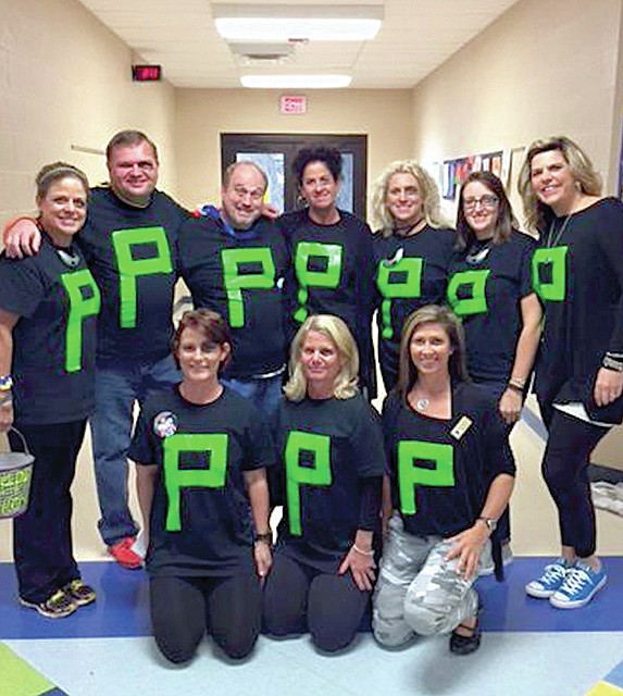 Submitted photo Lakeside Middle School's seventh-grade teachers helped start the school's Halloween celebration early by dressing as "blacked eye P's."