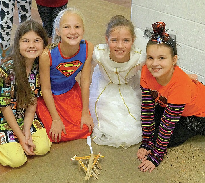 Submitted photo Lake Hamilton Intermediate School students, from left, Laney Hunter, Emma Hughes, Sheyla Praetzel and Jane Abernathy built a catapult for a measurement activity in LeaAnn Ferrell's class. The students built catapults, shot candy corn, measured and recorded the distance.