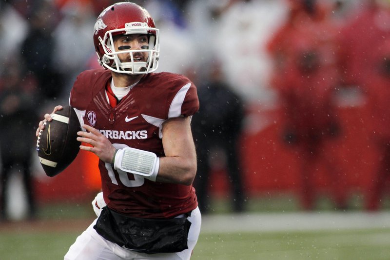Arkansas' Brandon Allen (10) looks for an open receiver during the first half of an NCAA college football game against Missouri, Friday, Nov. 27, 2015, in Fayetteville. (AP Photo/Samantha Baker)
