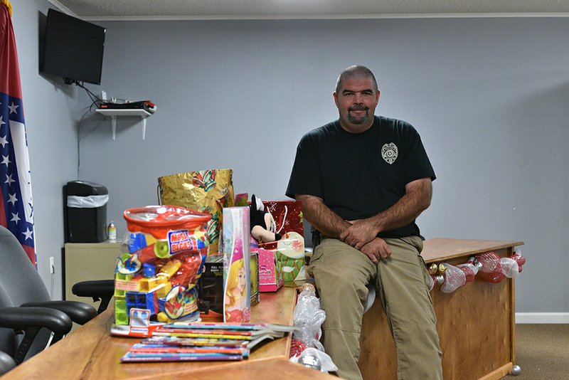 Higginson Police Chief Eric Patterson with toys recently donated in support of the local toy drive for St. Jude Childrens Hospital in Memphis, Tenn.