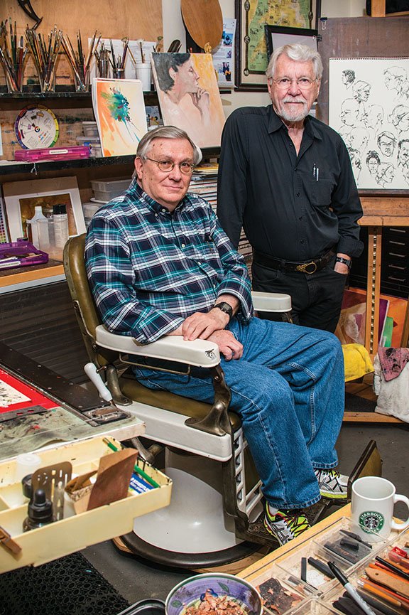 Hot Springs artists Richard Stephens, seated, and Gary Simmons pose in Simmons’ studio. The two artists will serve as grand marshals of the Oaklawn Rotary Christmas Parade on Dec. 7 in downtown Hot Springs. The theme of this year’s parade is “The Art of Christmas.”