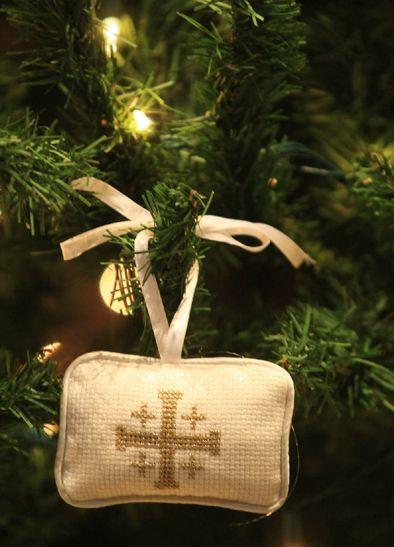 Chrismons, ornaments often crafted in gold and white and featuring symbols of Christ, are an Advent tradition in some Protestant churches. 