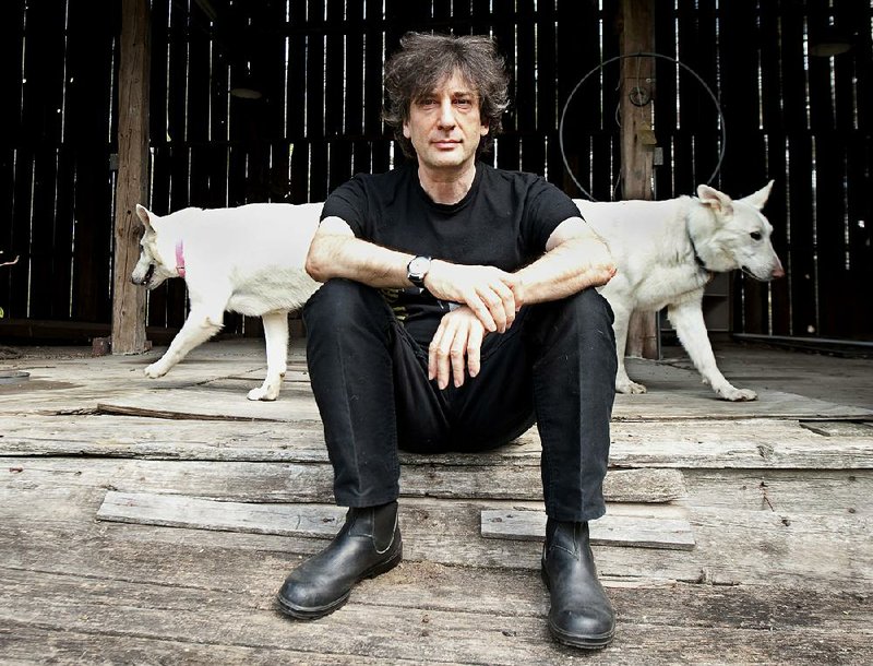 Best-selling author Neil Gaiman, 49, sits at an old barn near his writing gazebo at his home in western Wisconsin. 