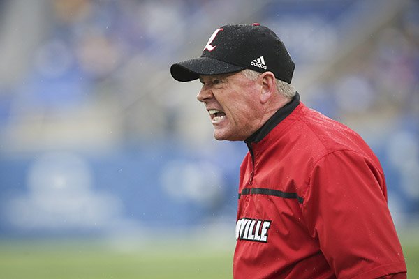 Louisville head coach Bobby Petrino screams at a referee after Kentucky scored a touchdown during the first half of an NCAA college football game Saturday, Nov. 28, 2015, in Lexington, Ky. (AP Photo/David Stephenson)