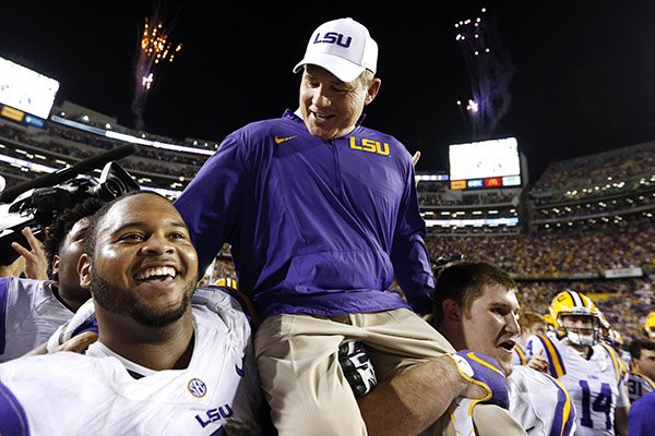 LSU head coach Les Miles is carried off the field after an NCAA college football game against Texas A&M in Baton Rouge, La., Saturday, Nov. 28, 2015. LSU won 19-7. (AP Photo/Jonathan Bachman)