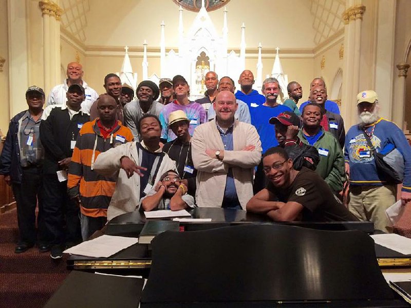 Donal Noonan (center) gathers with members of the Atlanta Homeward Choir at the Catholic Shrine of the Immaculate Conception in Atlanta. 