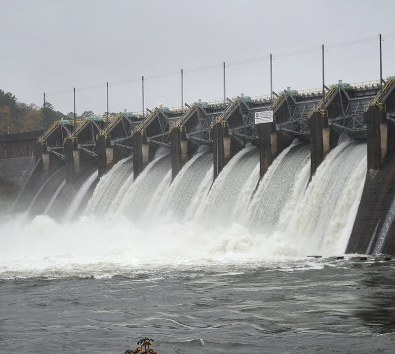 The Sentinel-Record/Mara Kuhn Carpenter Dam releases a little more than 31,000 cubic feet per second of water Saturday afternoon into Lake Catherine as Entergy Arkansas Inc. works to maintain lake levels. Further downstream, Remmel Dam was releasing about 41,000 cfs into the Ouachita River below Lake Catherine.