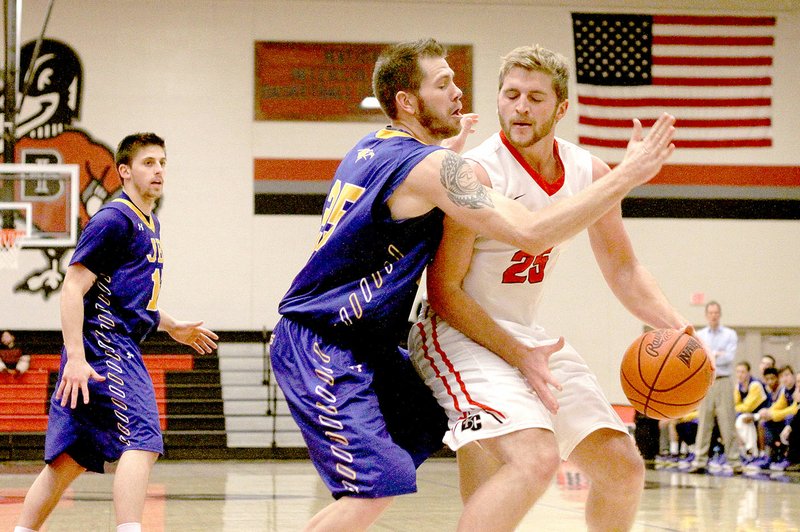 Photo submitted JBU senior forward Griffin Brady (25) guards a Benedictine player during Tuesday&#8217;s game in Atchison, Kan. Luke Moyer (15), a senior guard from Souderton, Pa., is at left. Brady is a 6-7 player from Salt Lake City, Utah.