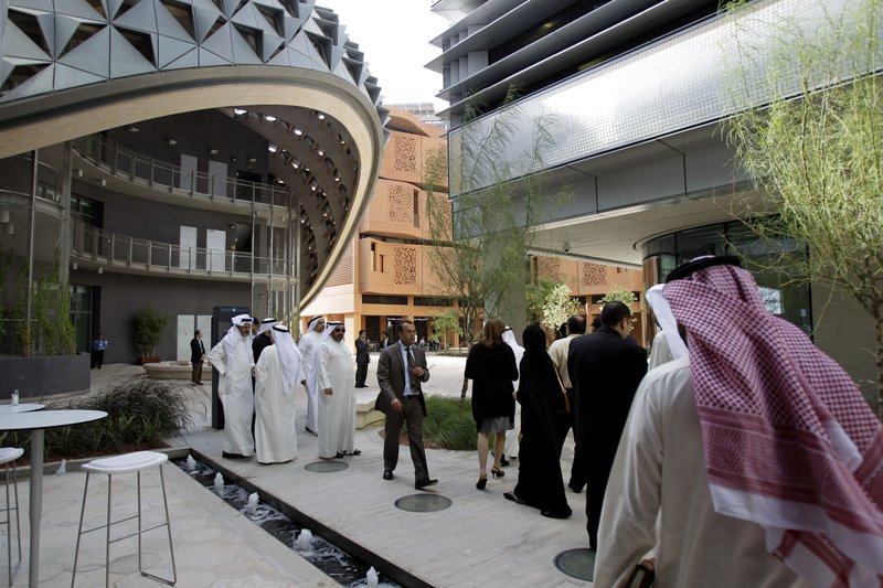  In this Sunday, Jan. 16, 2011 file photo, visitors of different nationalities visit the Masdar Institute campus,  part of Masdar City in Abu Dhabi, United Arab Emirates.  Israel will soon open an office at a renewable energy agency in Abu Dhabi, the capital of the United Arab Emirates  even though the two nations have no diplomatic relations, an Israeli Foreign Ministry spokesman said Friday, Nov. 27, 2015.