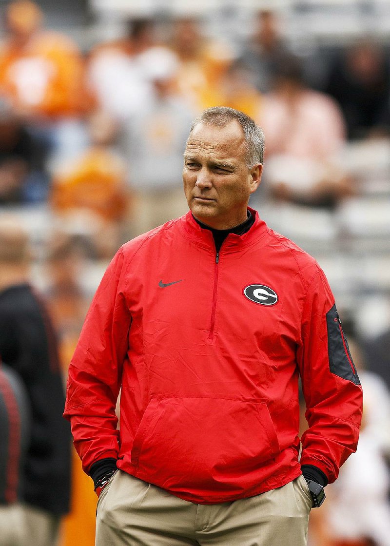 Georgia head football coach Mark Richt watches the team warmup before the Bulldogs' SEC conference football game against Tennessee at Neyland Stadium on Saturday, Oct. 10, 2015, in Knoxville, Tenn.