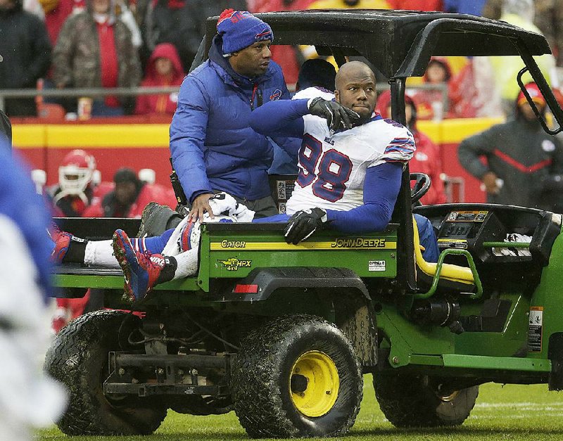 Buffalo Bills defensive tackle Alex Carrington (Arkansas State) is driven off the field after injuring his right knee in the second half Sunday in Kansas City, Mo.