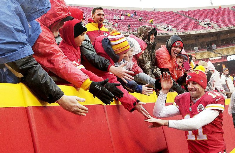 Kansas City Chiefs quarterback Alex Smith (11) celebrates with fans after the Chiefs’ 30-22 victory over the Buffalo Bills on Sunday in Kansas City, Mo. Smith threw for 255 yards and two touchdowns in the game.