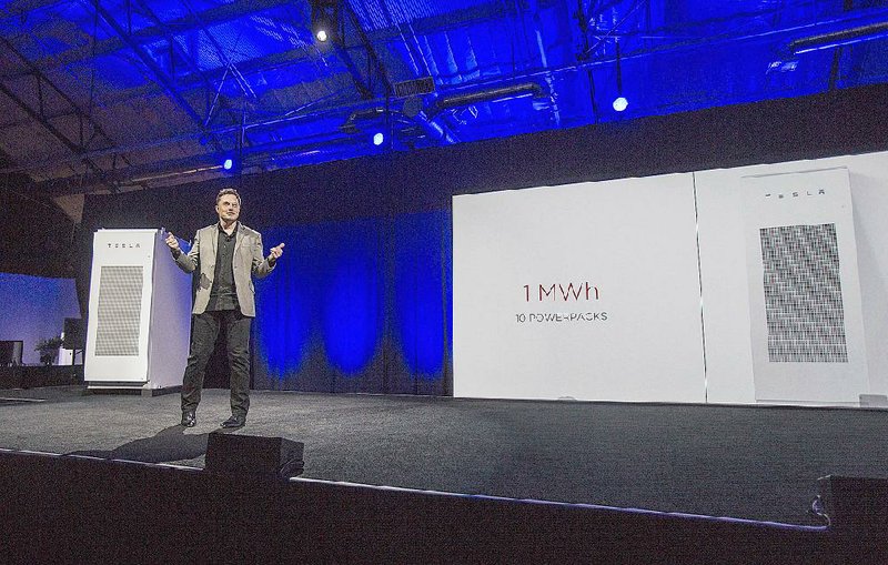 Tesla Motors Inc. CEO Elon Musk unveils the company’s Powerpack battery earlier this year in Hawthorne, Calif.