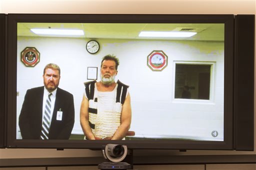 Colorado Springs Planned Parenthood shooting suspect Robert Dear, right, appears via video hearing during his first court appearance, where he was told he faces first-degree murder charges, Monday, Nov. 30, 2015, in Colorado Springs, Colo. 