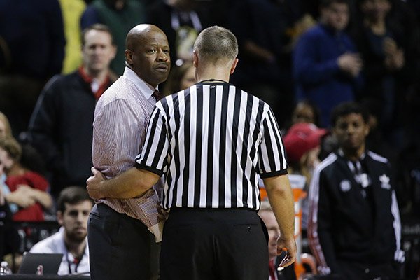 Arkansas head coach Mike Anderson is escorted away by a referee after getting a technical during the second half of an NCAA college basketball game against Stanford in the consolation round of the NIT Season Tip-Off tournament Friday, Nov. 27, 2015, in New York. Stanford won 69-66. (AP Photo/Frank Franklin II)
