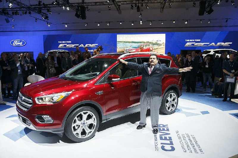 Guillermo Rodriguez of Jimmy Kimmel Live stands next to a 2017 Ford Escape displayed last month at the Los Angeles Auto Show.