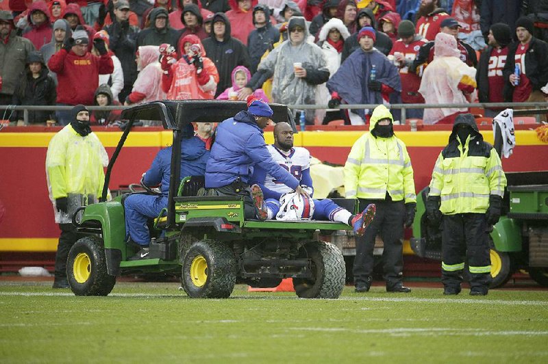 Buffalo Bills defensive tackle Alex Carrington (98) is driven off the field following an injury in the second half of an NFL football game against the Kansas City Chiefs in Kansas City, Mo., Sunday, Nov. 29, 2015. 