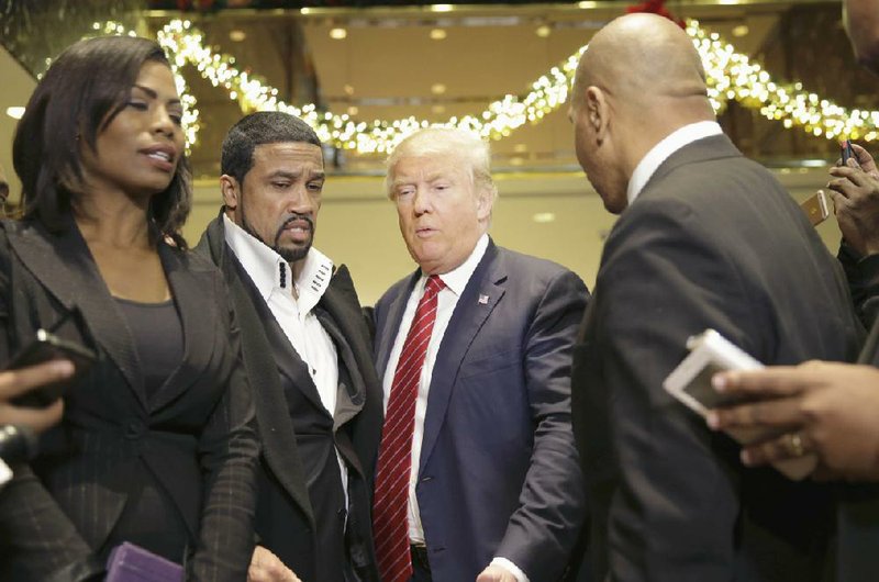 Republican presidential candidate Donald Trump joins a group of black religious leaders Monday for a news conference after a meeting in New York.