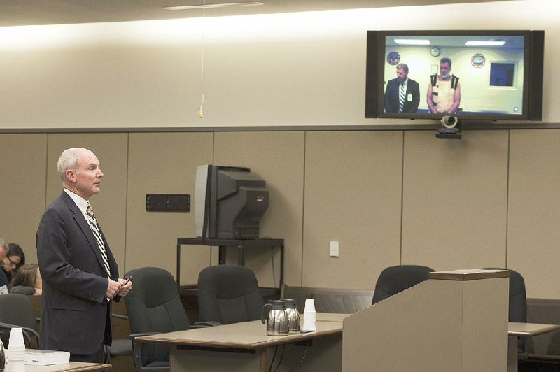 Fourth Judicial District Attorney Dan May speaks Monday in Colorado Springs, Colo., during the first court appearance for Robert Lewis Dear, the suspect in shootings at the Colorado Springs Planned Parenthood. Dear, who appeared via video, faces fi rst-degree murder charges.